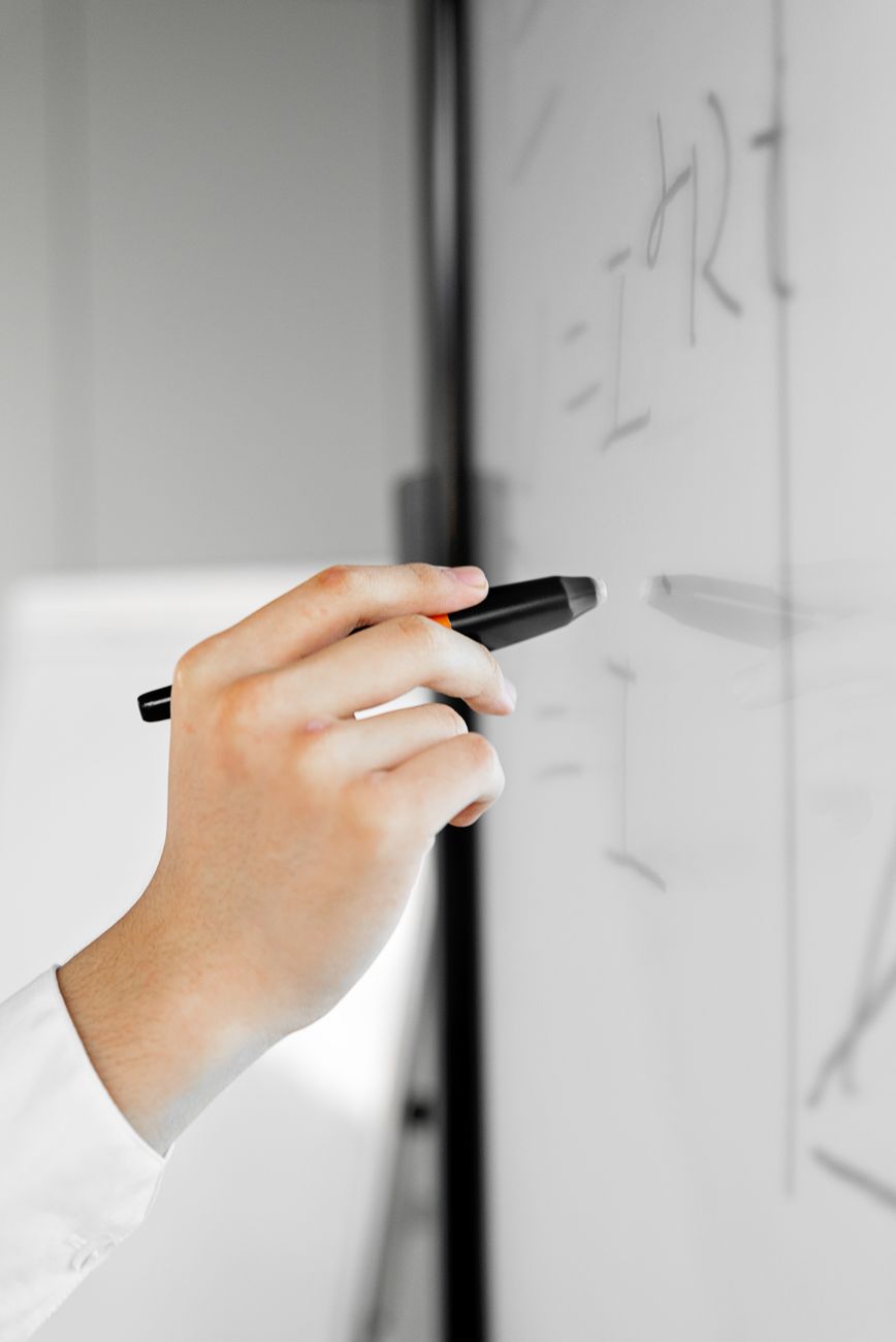 a person making a business presentation using a stylus pen